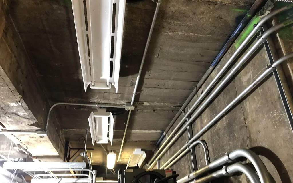 Installed conduit and cable pathway in a commercial building.